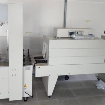Shrink wrapping machine